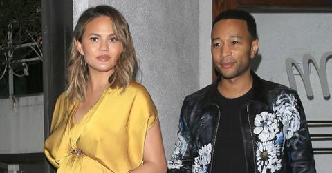 Pregnant Chrissy Teigen looks amazing in a gold dress for dinner with her man John Legend