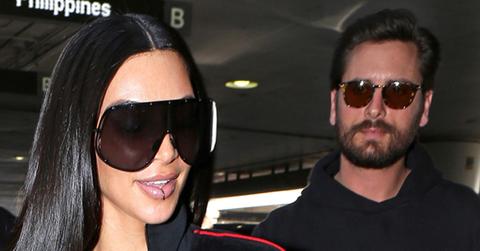 Kim Kardashian draws a crowd at LAX with Scott Disick