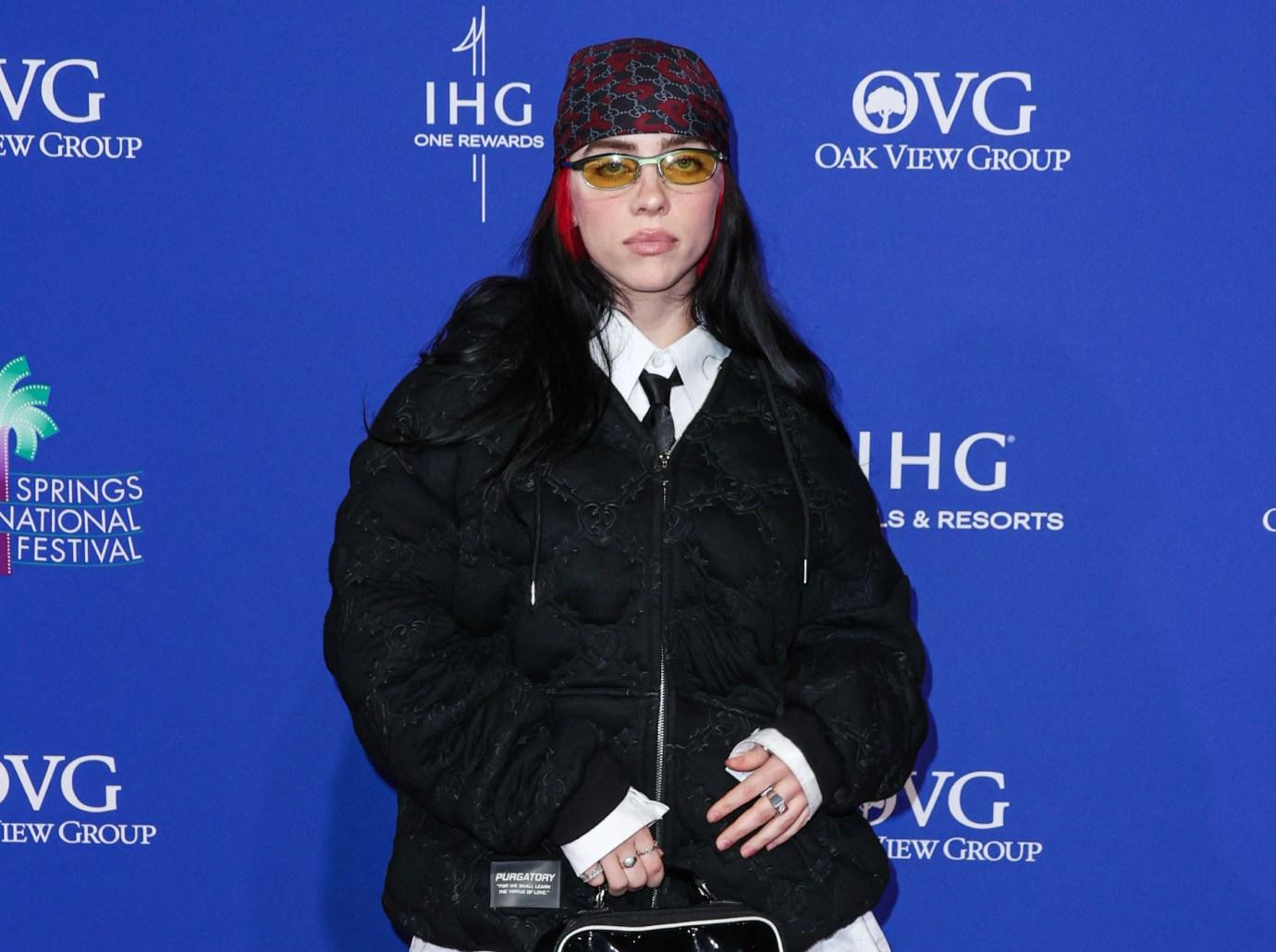 Billie Eilish laughs off wardrobe malfunction as she covers boobs