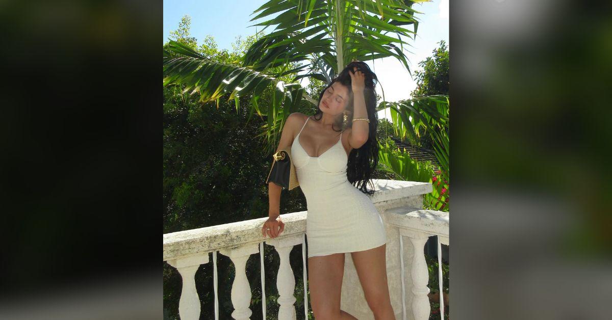 kylie jenner flaunts curves cleavage baring white dress photos
