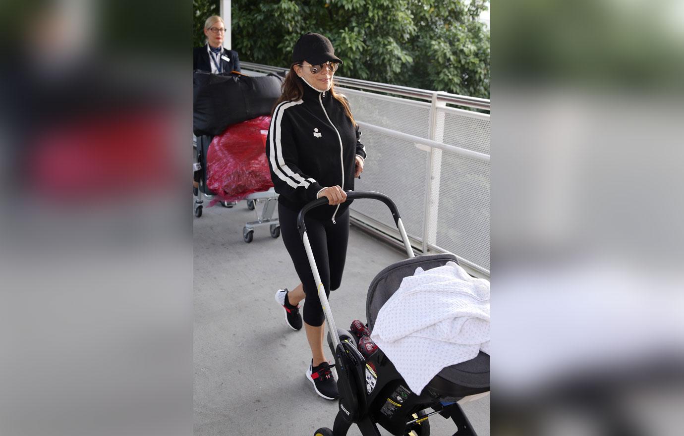 EXCLUSIVE: Eva Longoria arrives back in Australia with baby Santiago