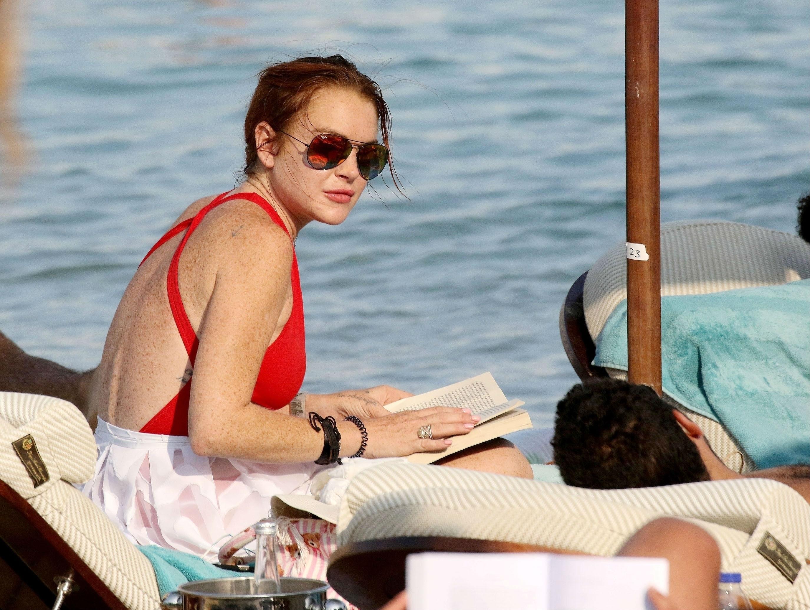 Lindsay Lohan Vacations In Mykonos In Red Swimsuit Photos reading2