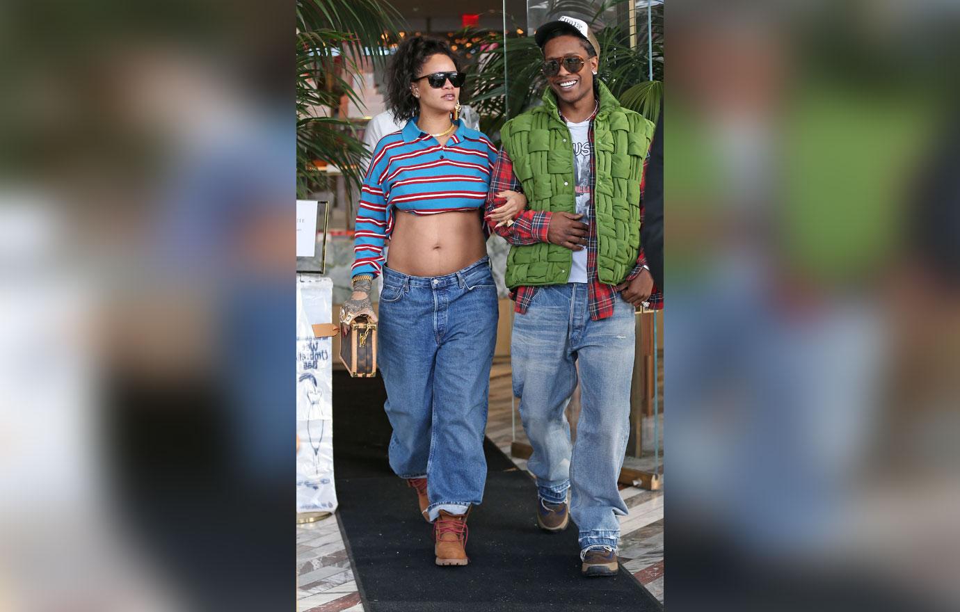 rihanna shows off baby bump as she walks arm in arm with aap rocky