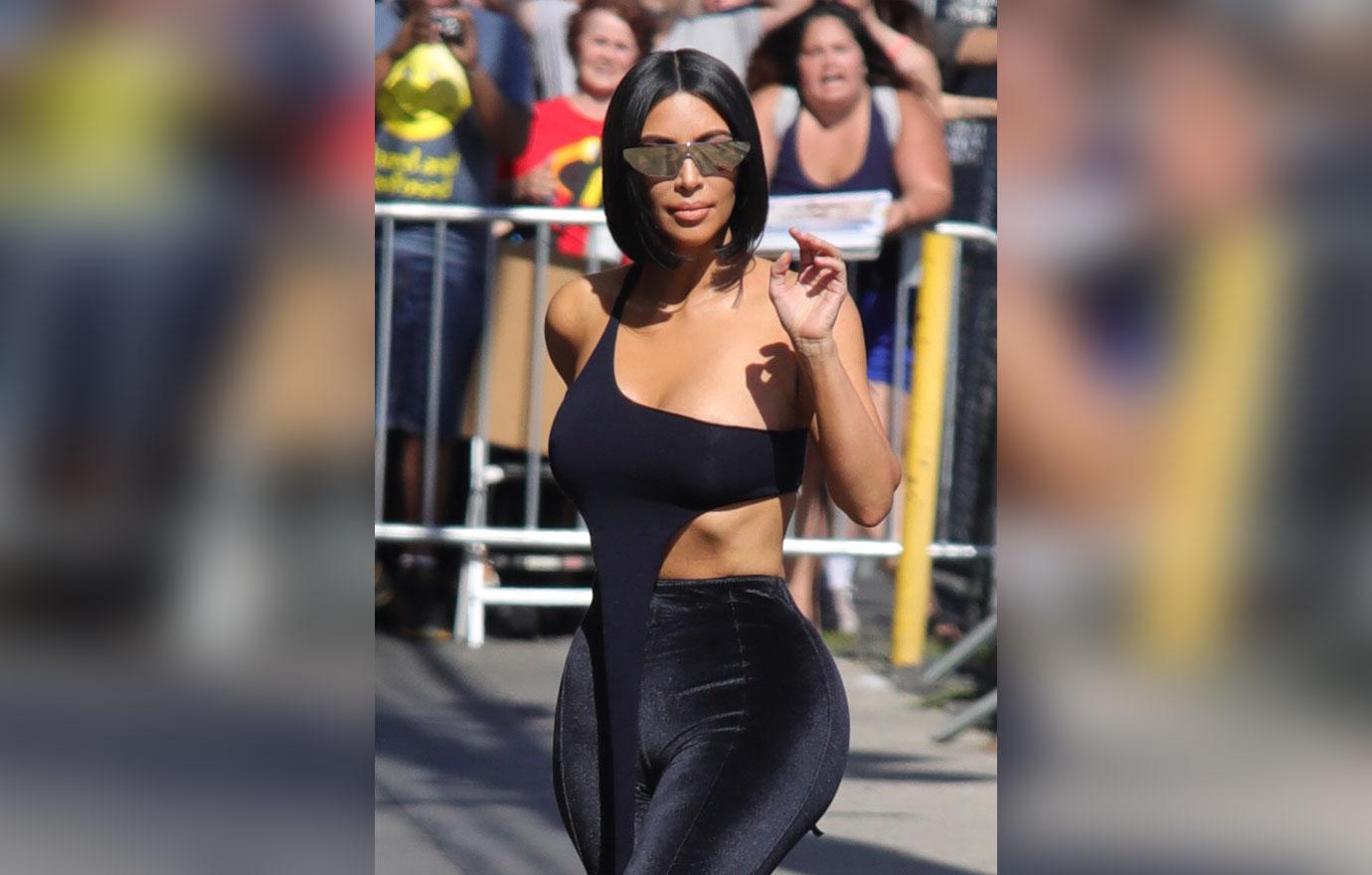 Kim Kardashian waving