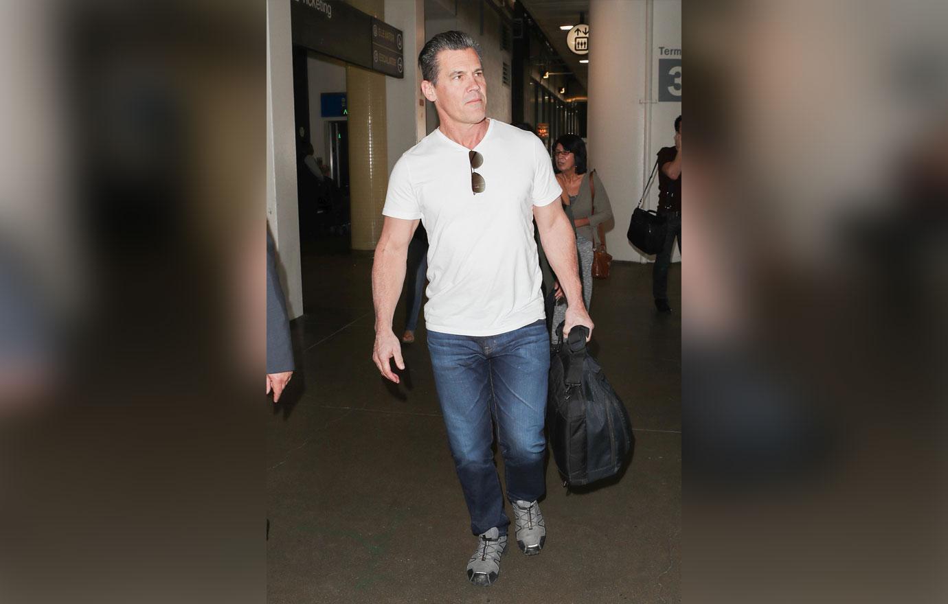 josh brolin white tee in airport