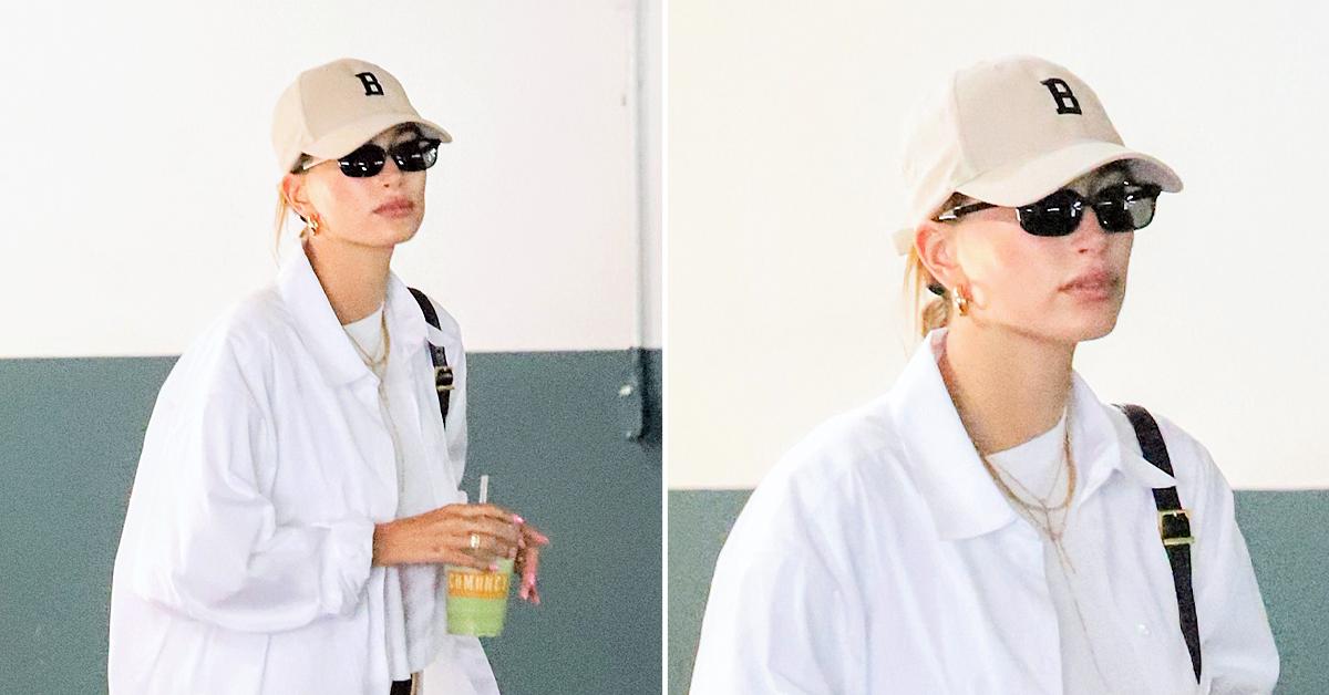 Hailey Bieber Dresses Down In Oversized Co Shirt, Bronze56K 'B' Cap