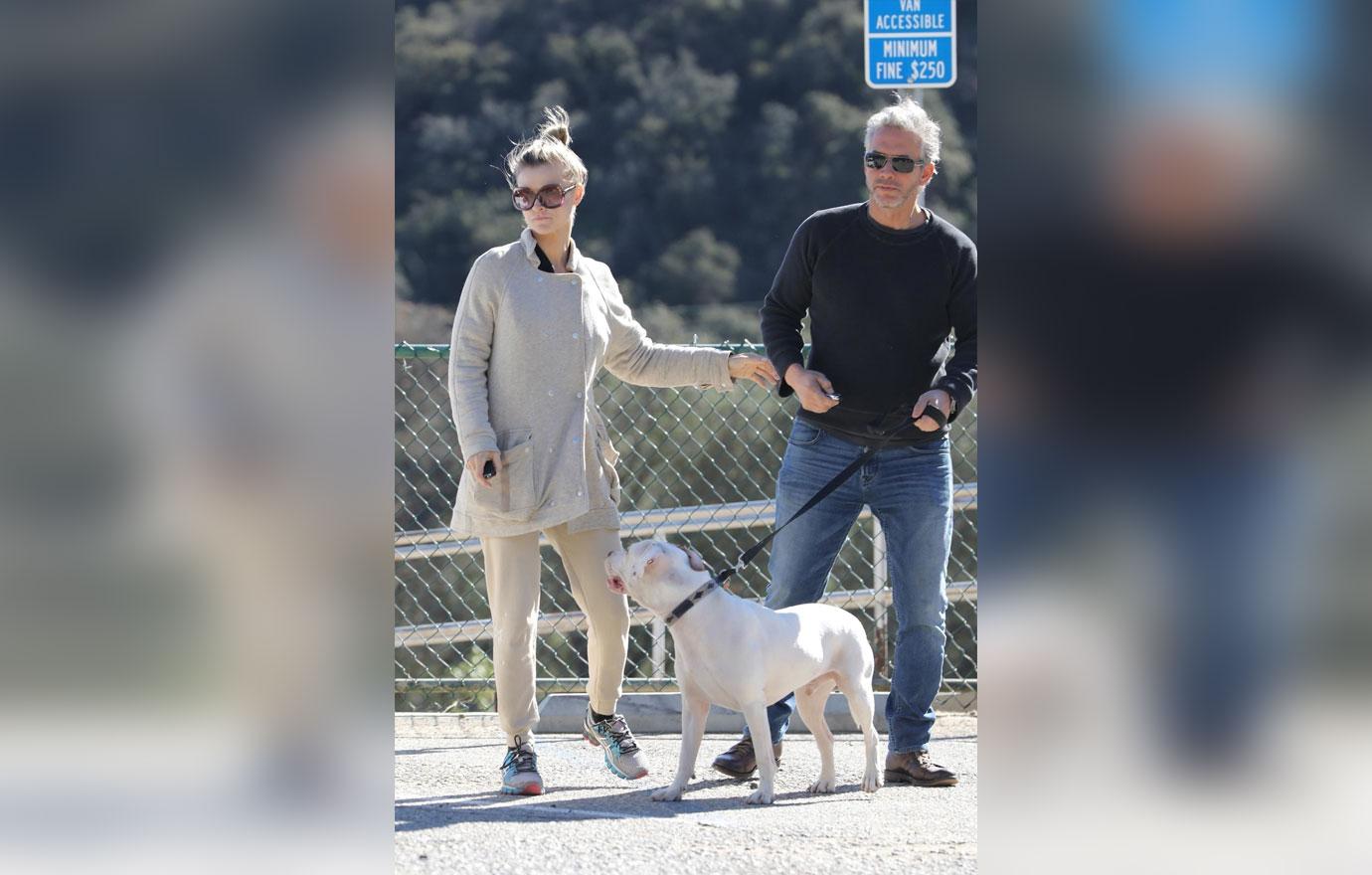 *EXCLUSIVE* Joanna Krupa packs on the PDA on an outing to the dog park with a mystery man