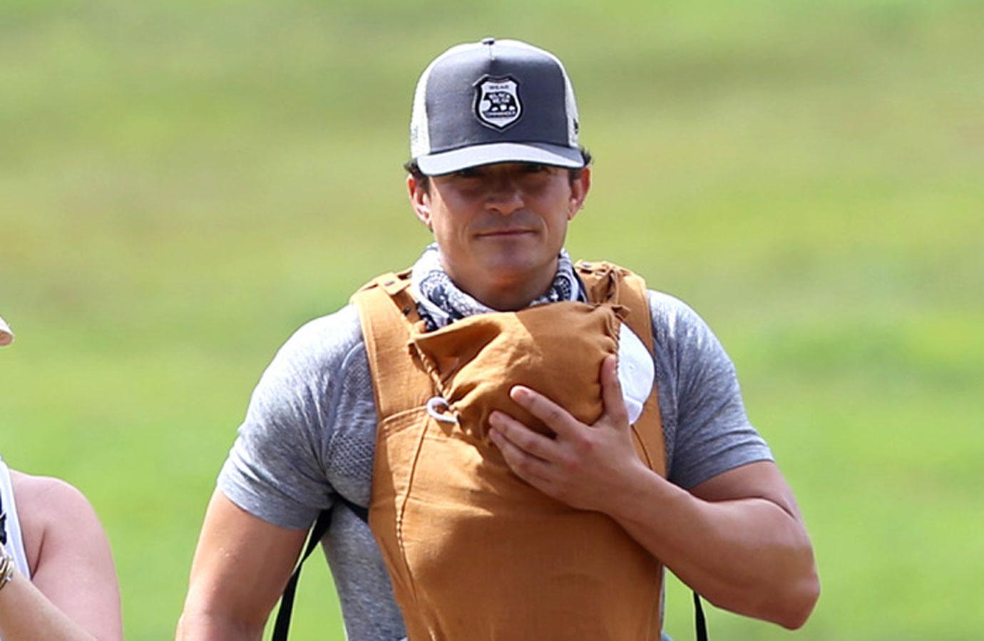 orlando bloom carries daisy dove bloom chest carrier on a hike