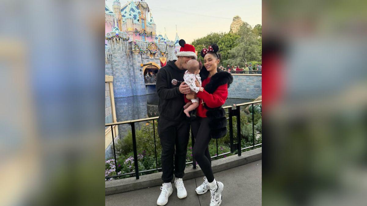photo of Olivia Culpo, Christian McCaffrey and their daughter.