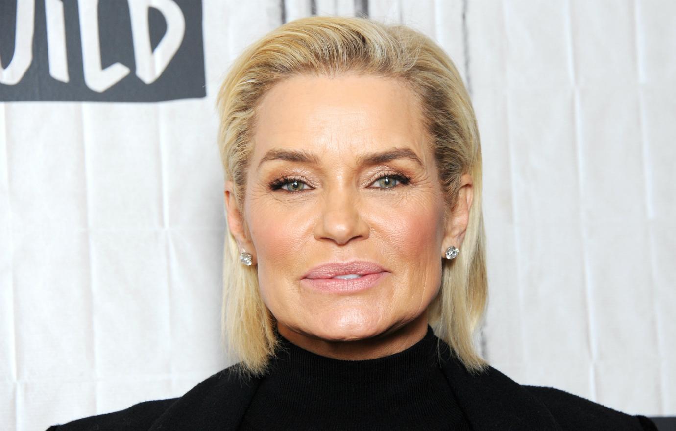 Yolanda Hadid wears a black turtleneck with her mid-length blonde hair slicked back to discuss her show Making a Model.