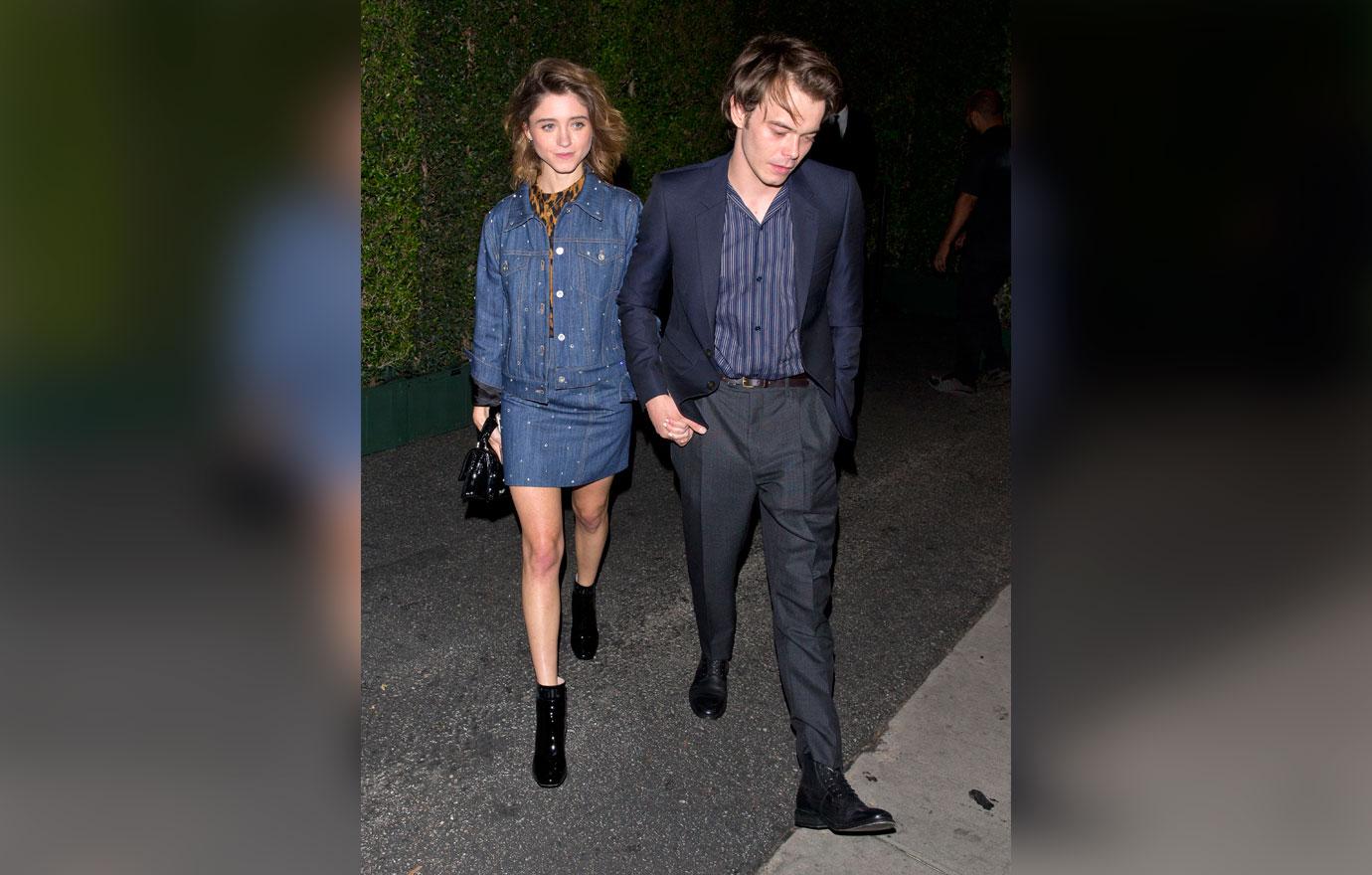 Natalia Dyer and Charlie Heaton hold hands as they leave the &#8216;MIU MIU&#8217; clothing launch in West Hollywood, CA