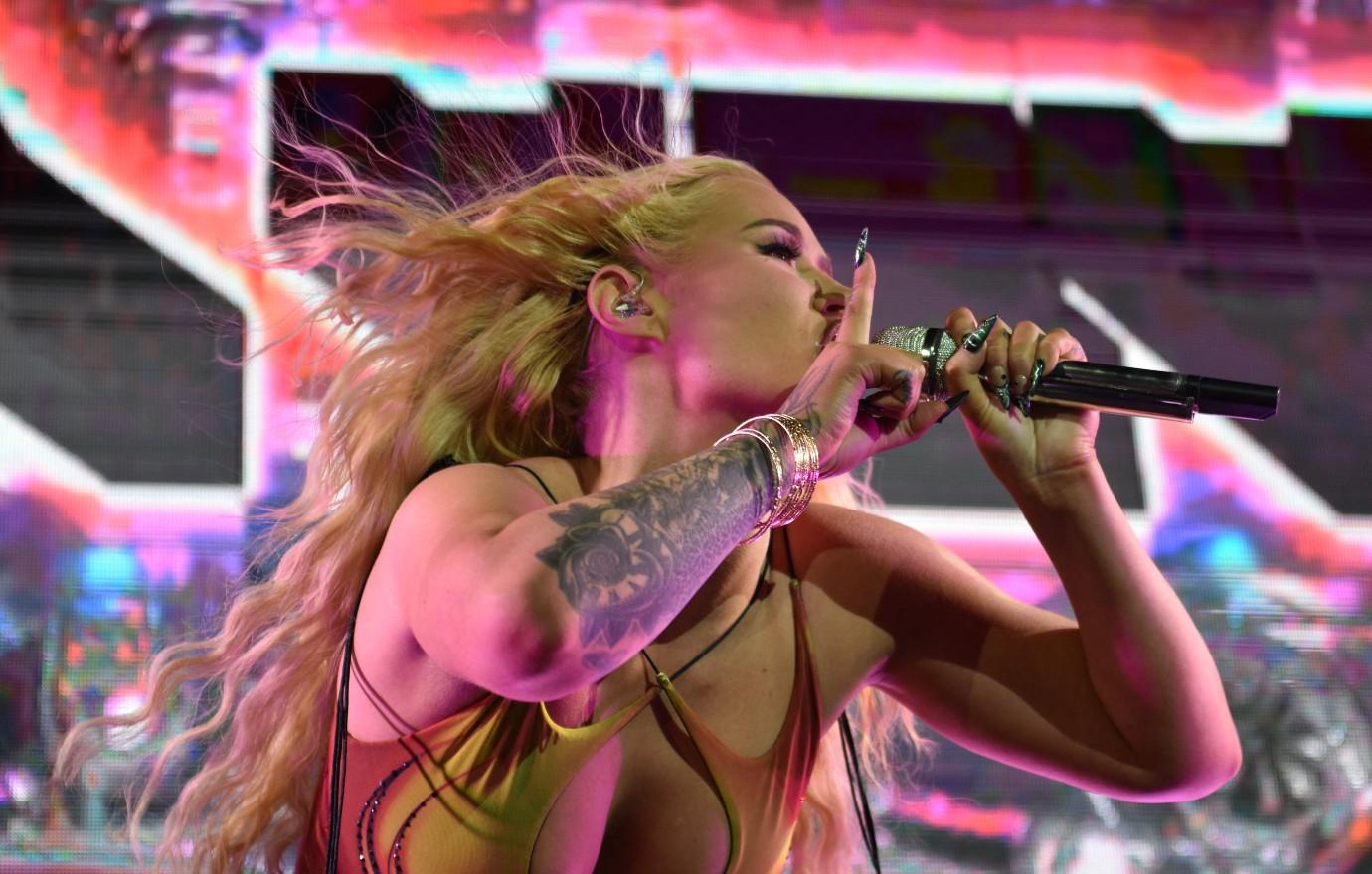 Rapper Iggy Azalea performs at halftime of a game between the