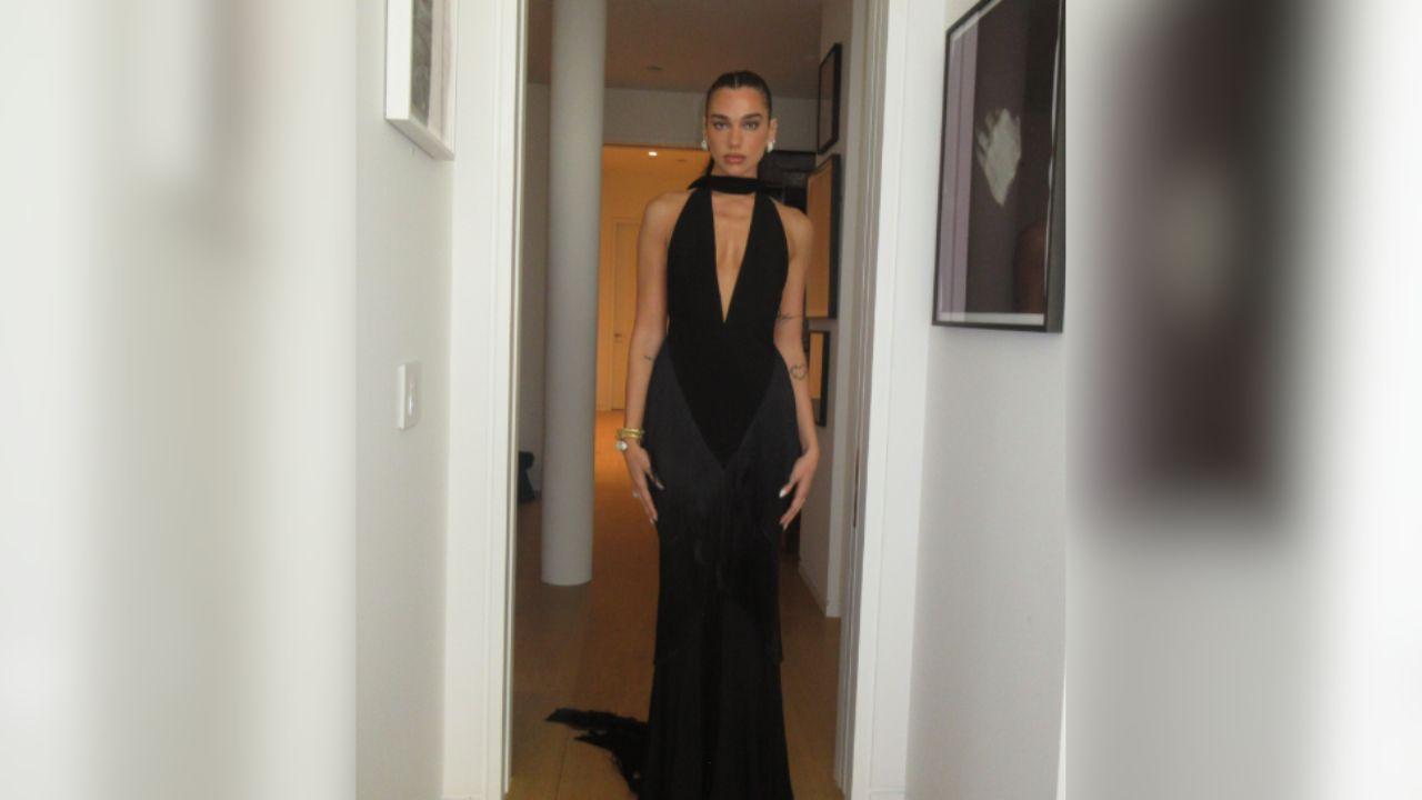 Image of Dua Lipa paired the custom gown with minimal accessories.