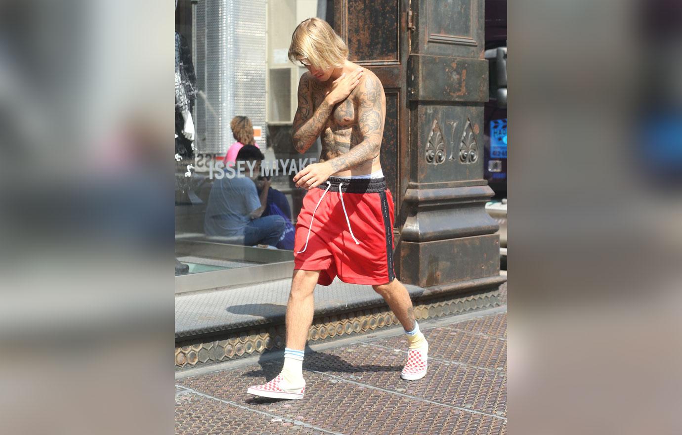 Justin bieber bares chest tattoos shirtless in NYC 4