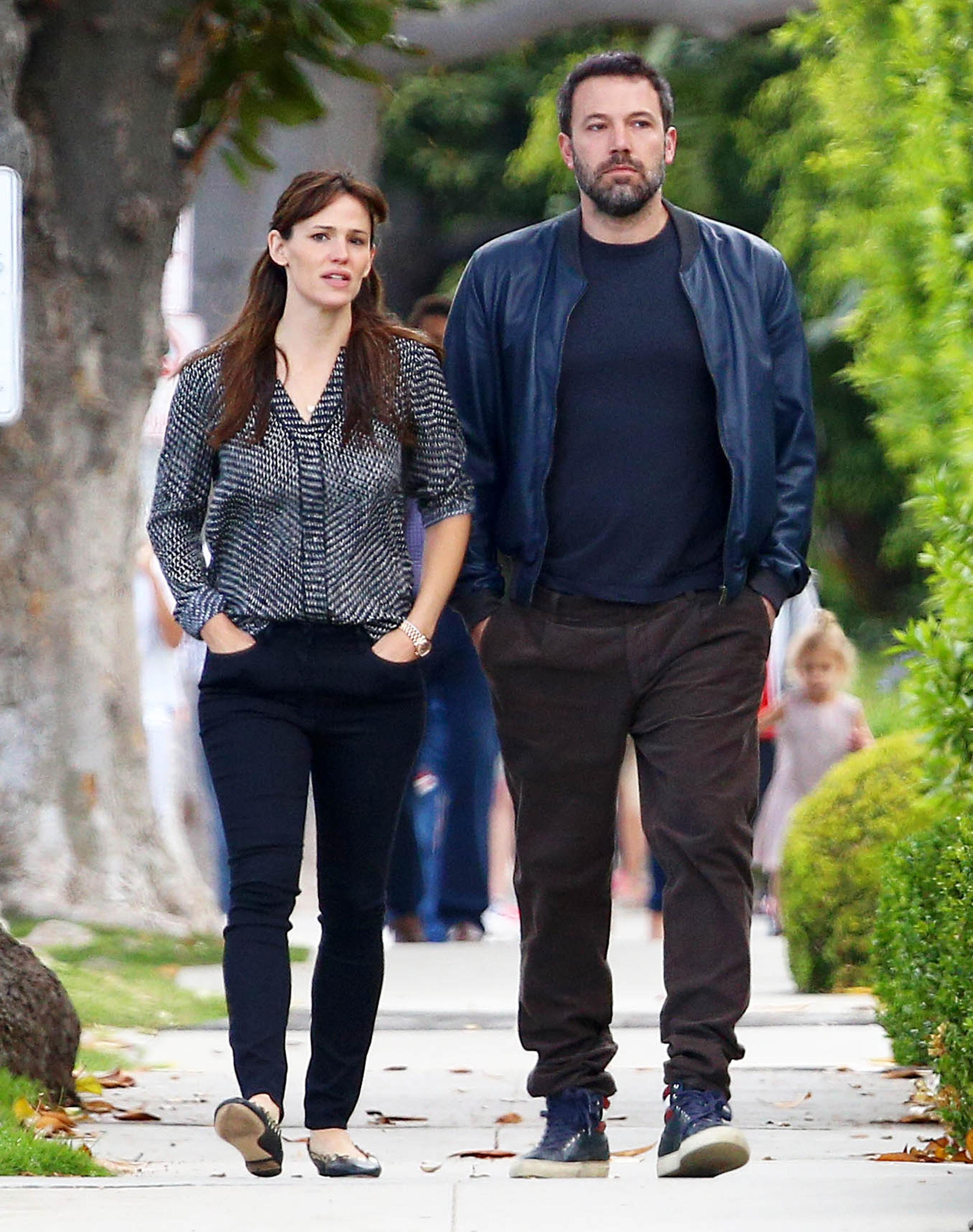 Pensive looking couple Jennifer Garner and Ben Affleck keep to themselves