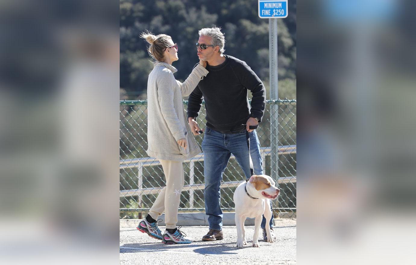 *EXCLUSIVE* Joanna Krupa packs on the PDA on an outing to the dog park with a mystery man