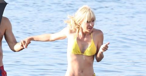 Anna Faris goes for a dip in a tiny yellow bikini on the set of ‘Overboard’