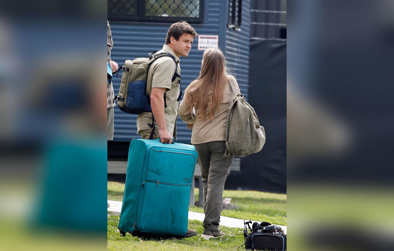 Pregnant Bindi Irwin and Chandler Powell at airport on the anniversary of Steve Irwin's death