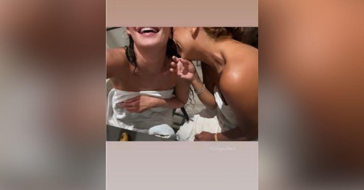 image of Kylie Jenner shared a playful vacation video showing herself wrapped in a white towel while laughing with friends in Turks and Caicos.