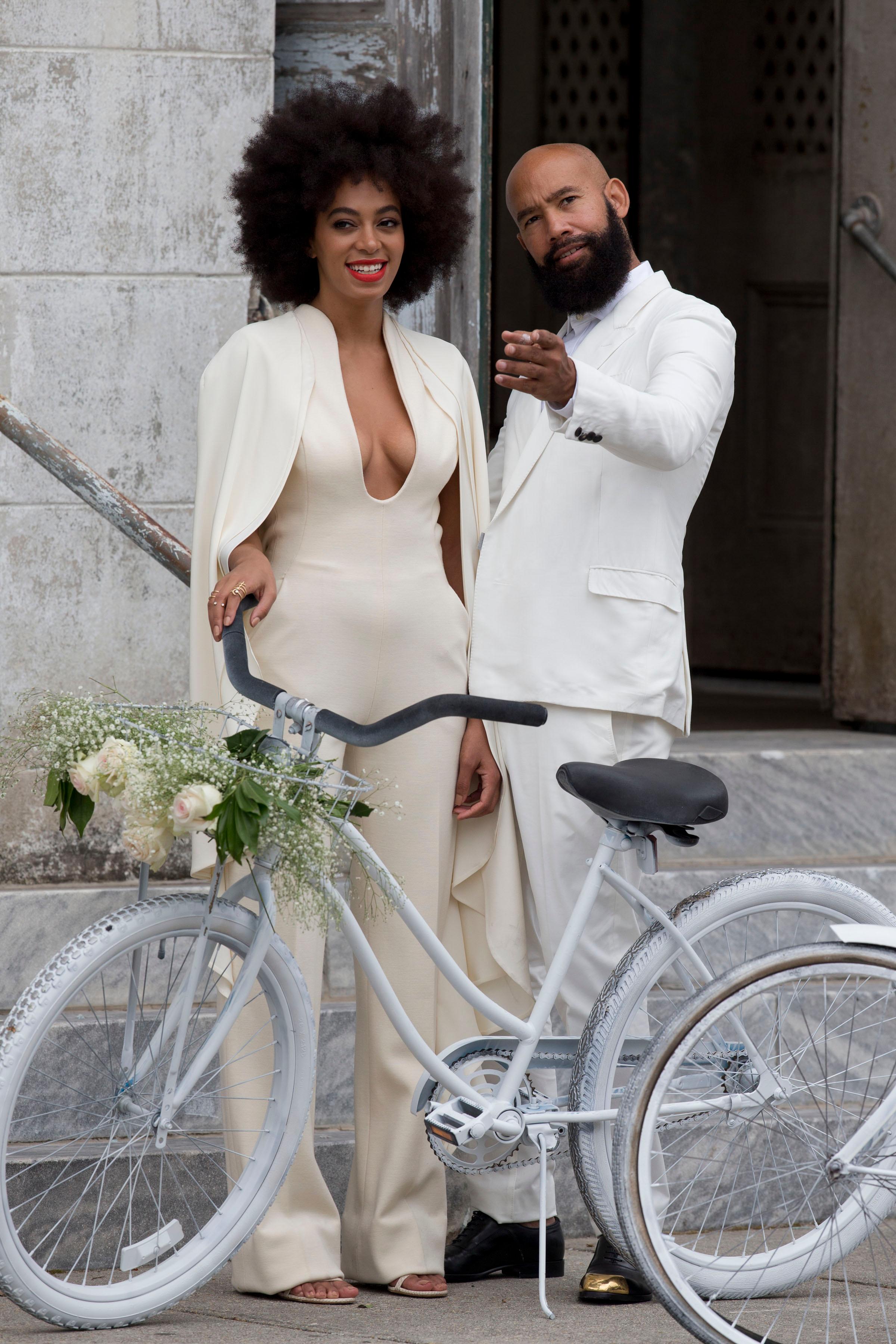 Solange Knowles and Alan Ferguson arrive at their wedding on white bicycles