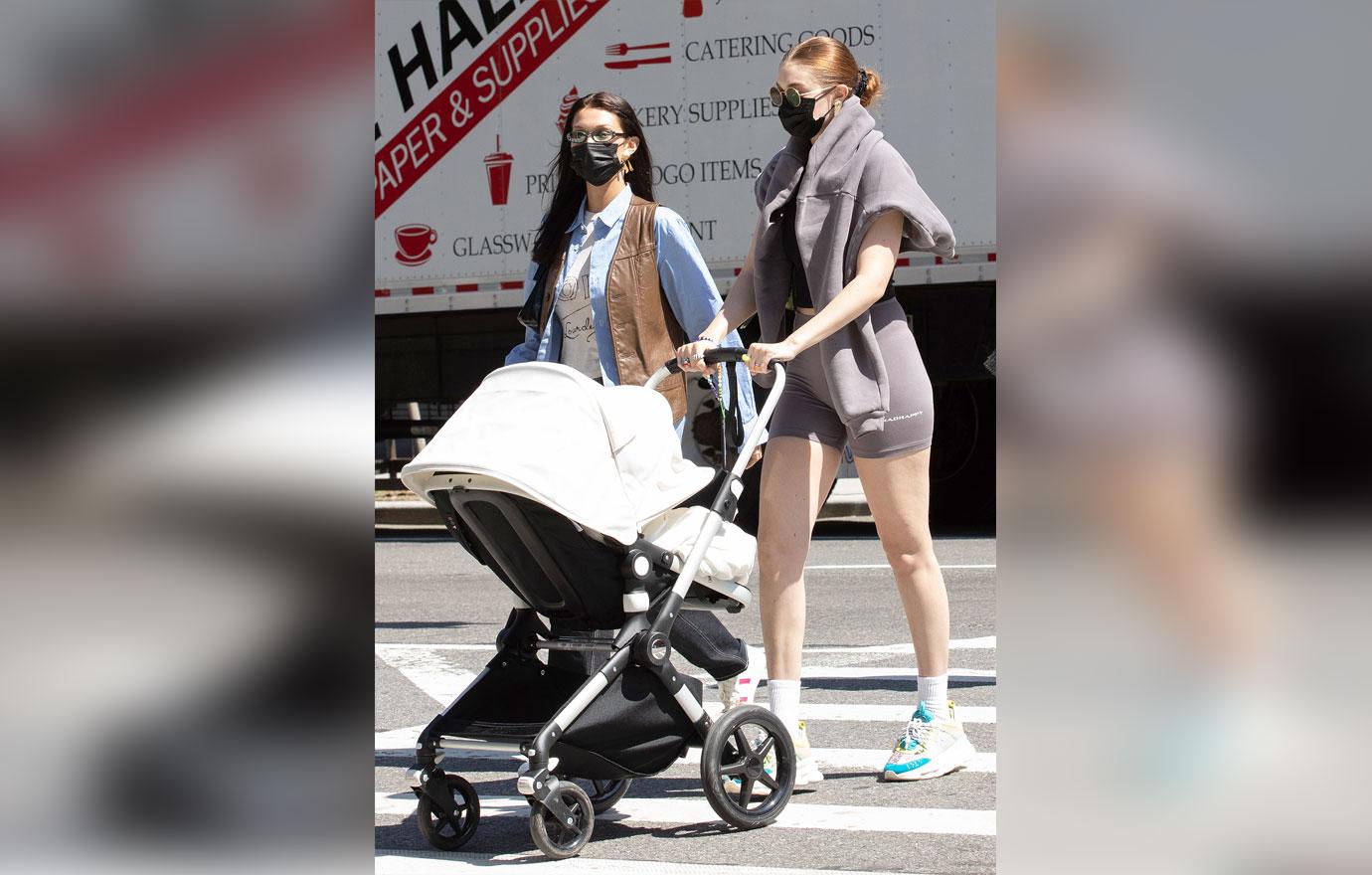 gigi hadid and bella hadid take baby khai for a walk