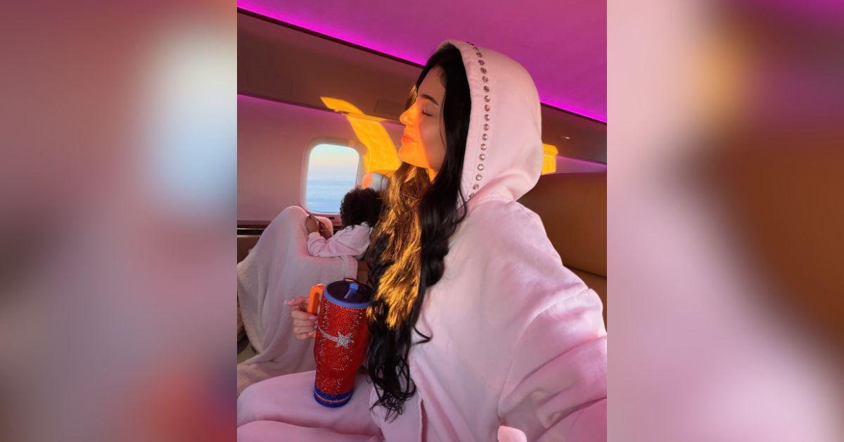 image of After arriving in Turks and Caicos, Kylie Jenner posted additional photos from a sunset dinner while wearing a pink bikini and mini skirt.