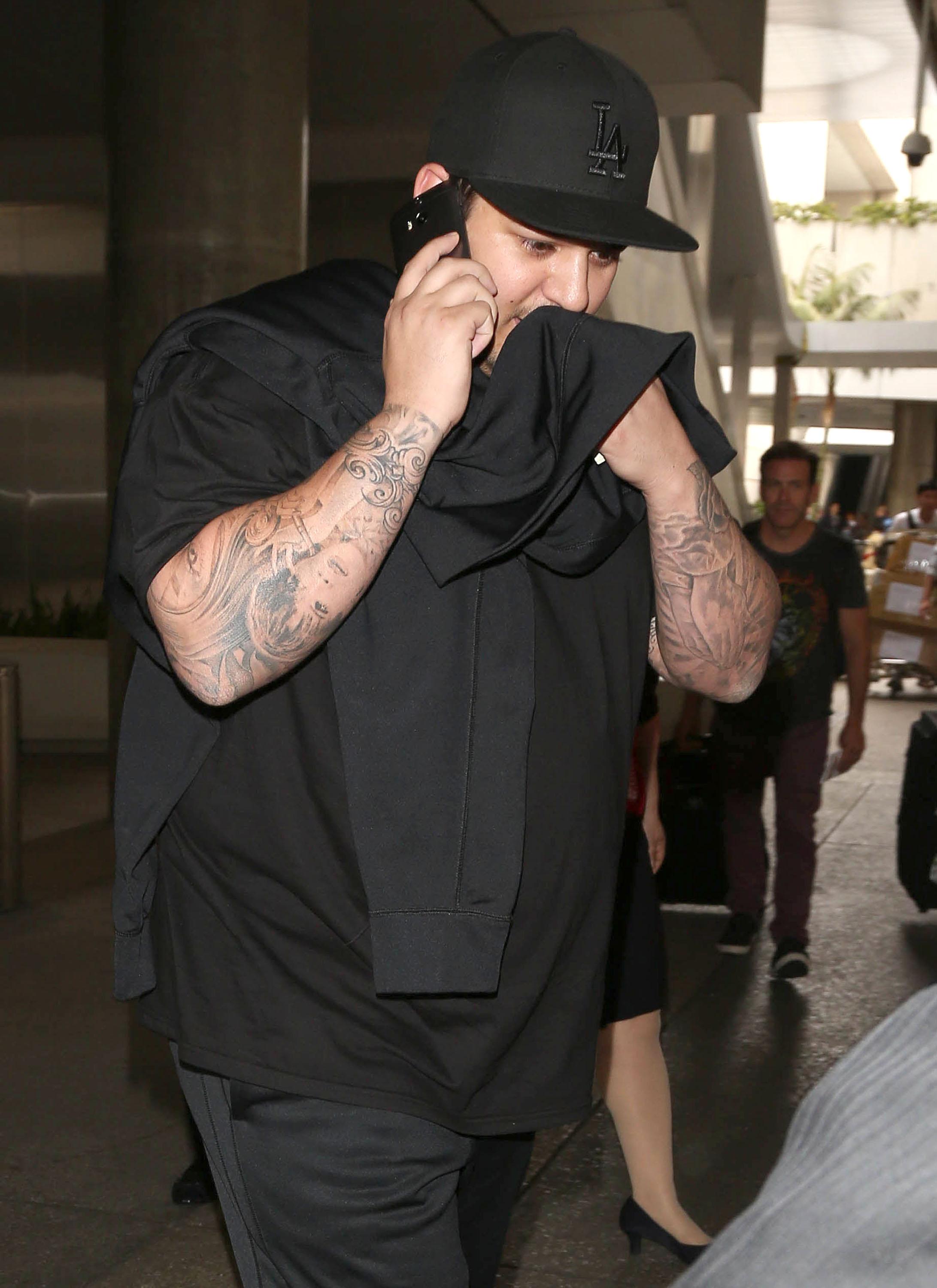 Fat Rob Kardashian Arriving On A Flight At LAX