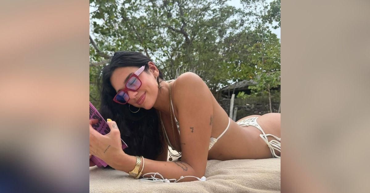 image of Dua Lipa flaunted her backside in a tiny G-string bikini.