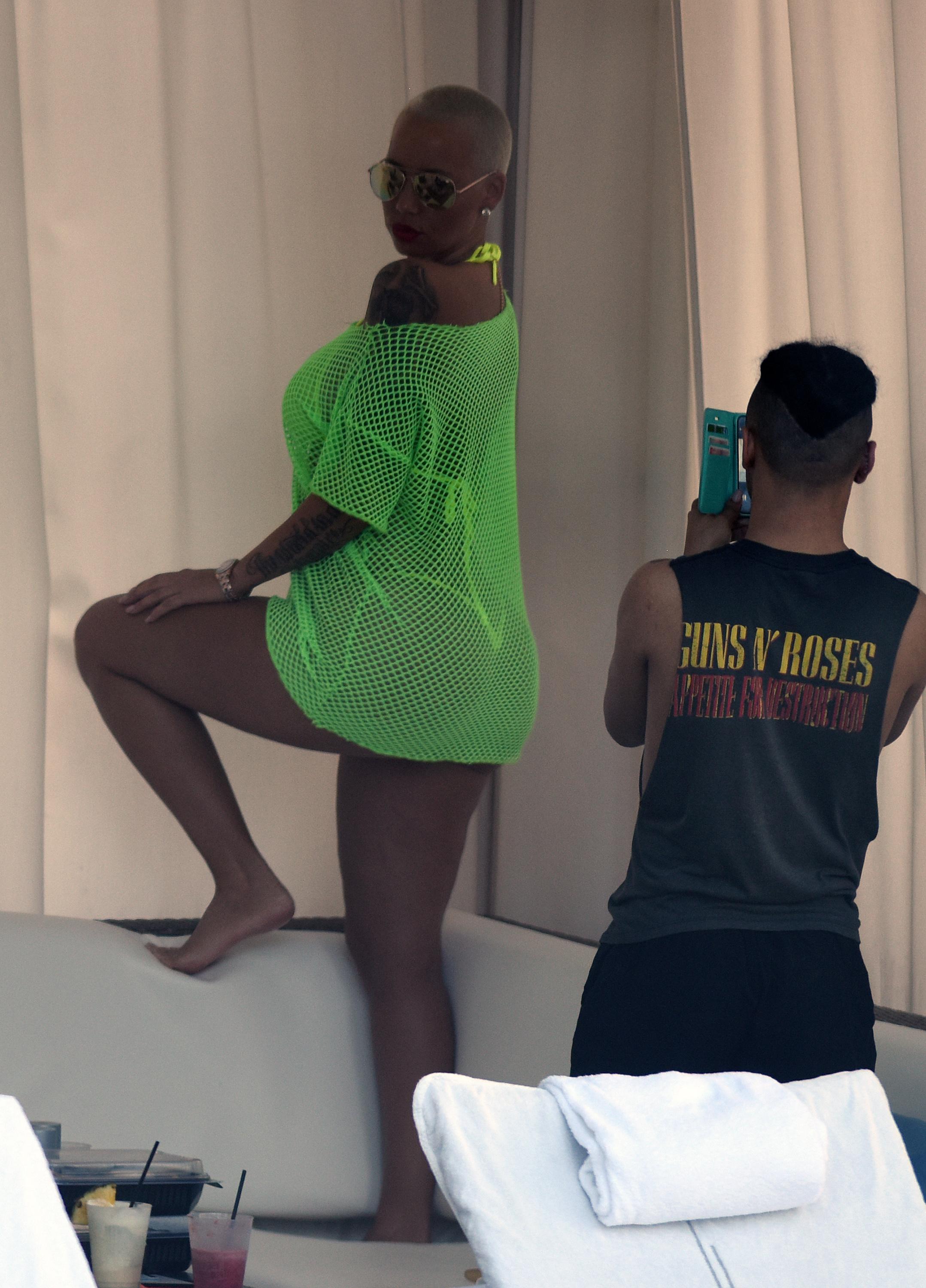 INF &#8211; Amber Rose Wears A Neon Yellow Thong Bikini By The Pool In Miami Beach