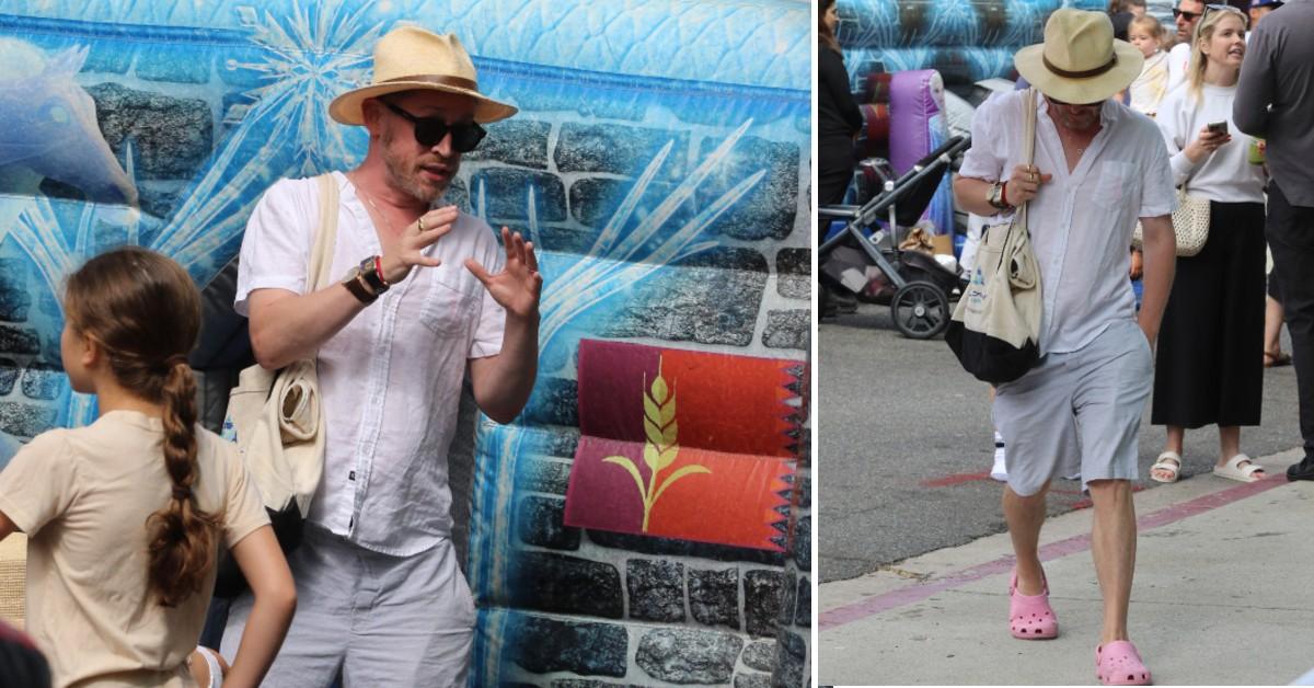 image of Macaulay Culkin completed the outfit with pink Crocs.