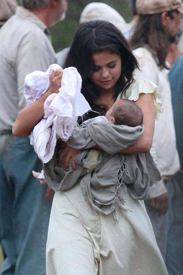 Selena Gomez Holds Baby On Set