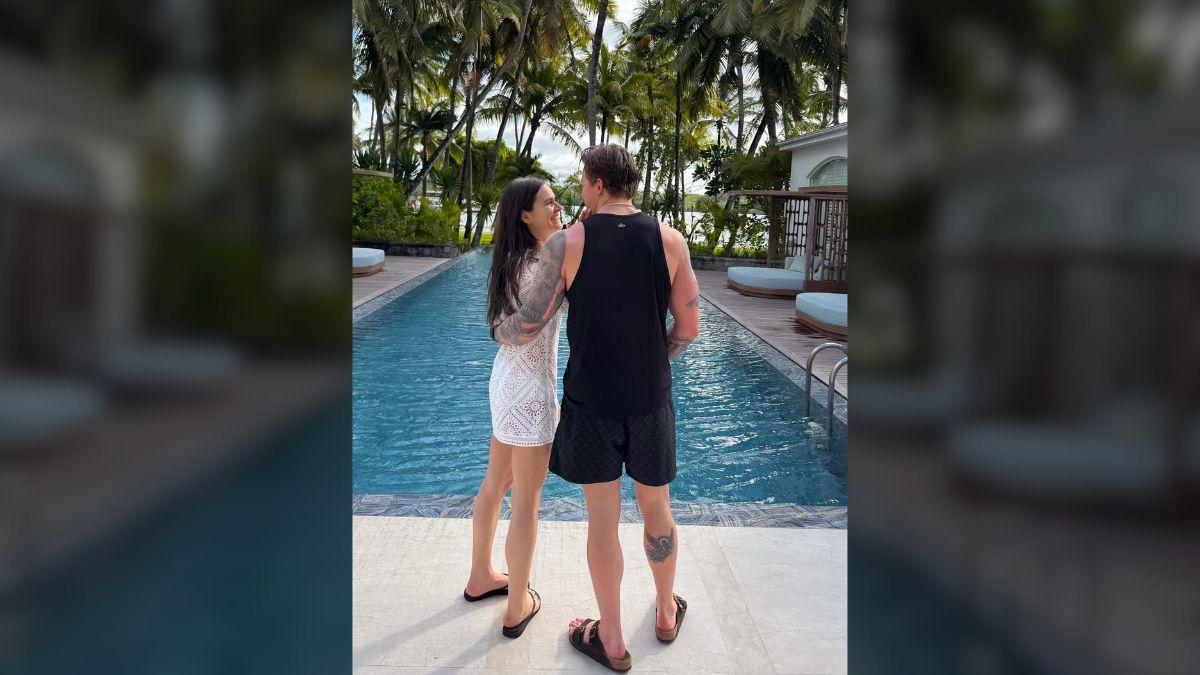 image of The couple relaxed by the pool and enjoyed their romantic getaway along the Belle Mare coastline.