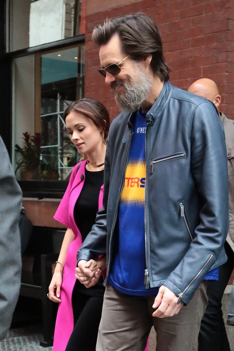 Jim Carrey and Cathriona White leave their hotel hand in hand