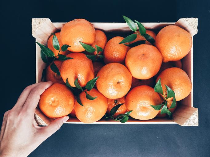 Oranges in a wooden crate