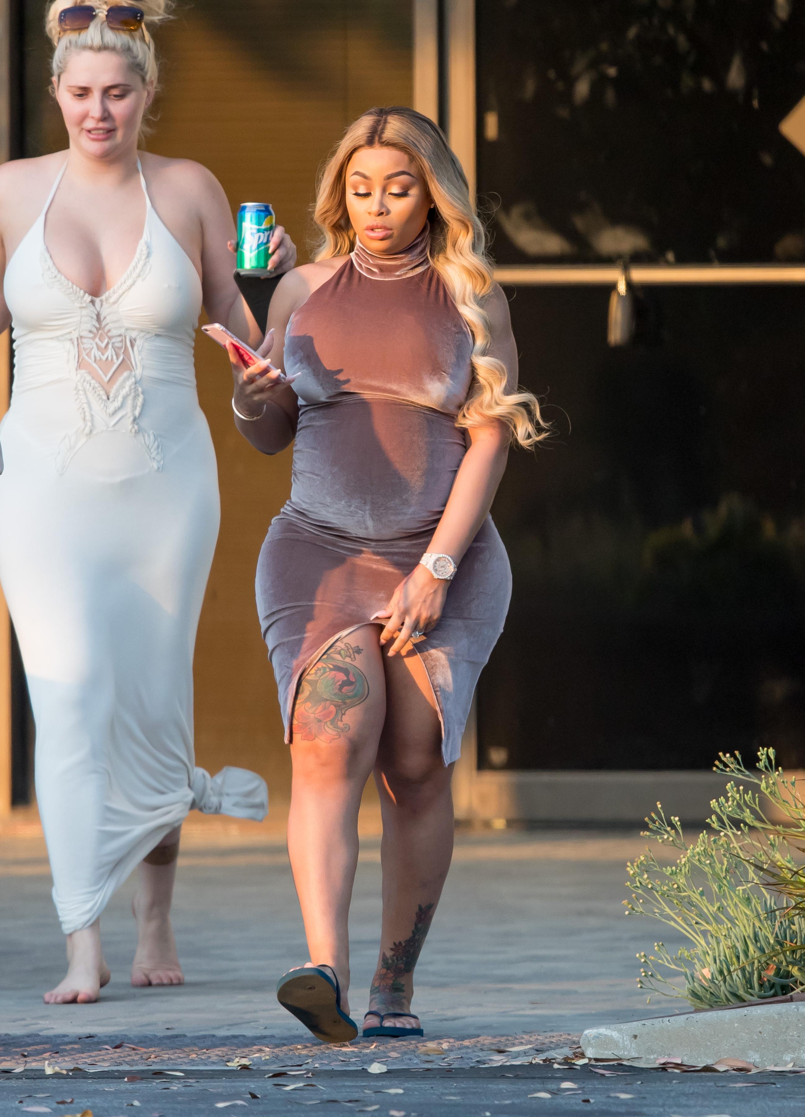 EXCLUSIVE: Pregnant Blac Chyna shows her curves in a  tight dress while out with friends in Los Angeles