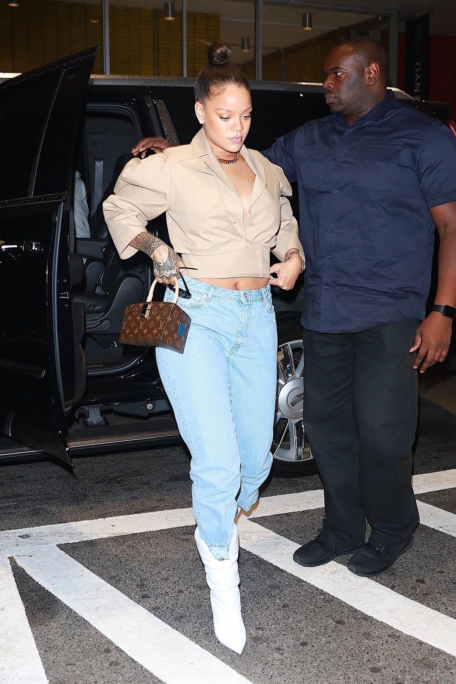 Rihanna rocks cowboy boots for a night out on the town