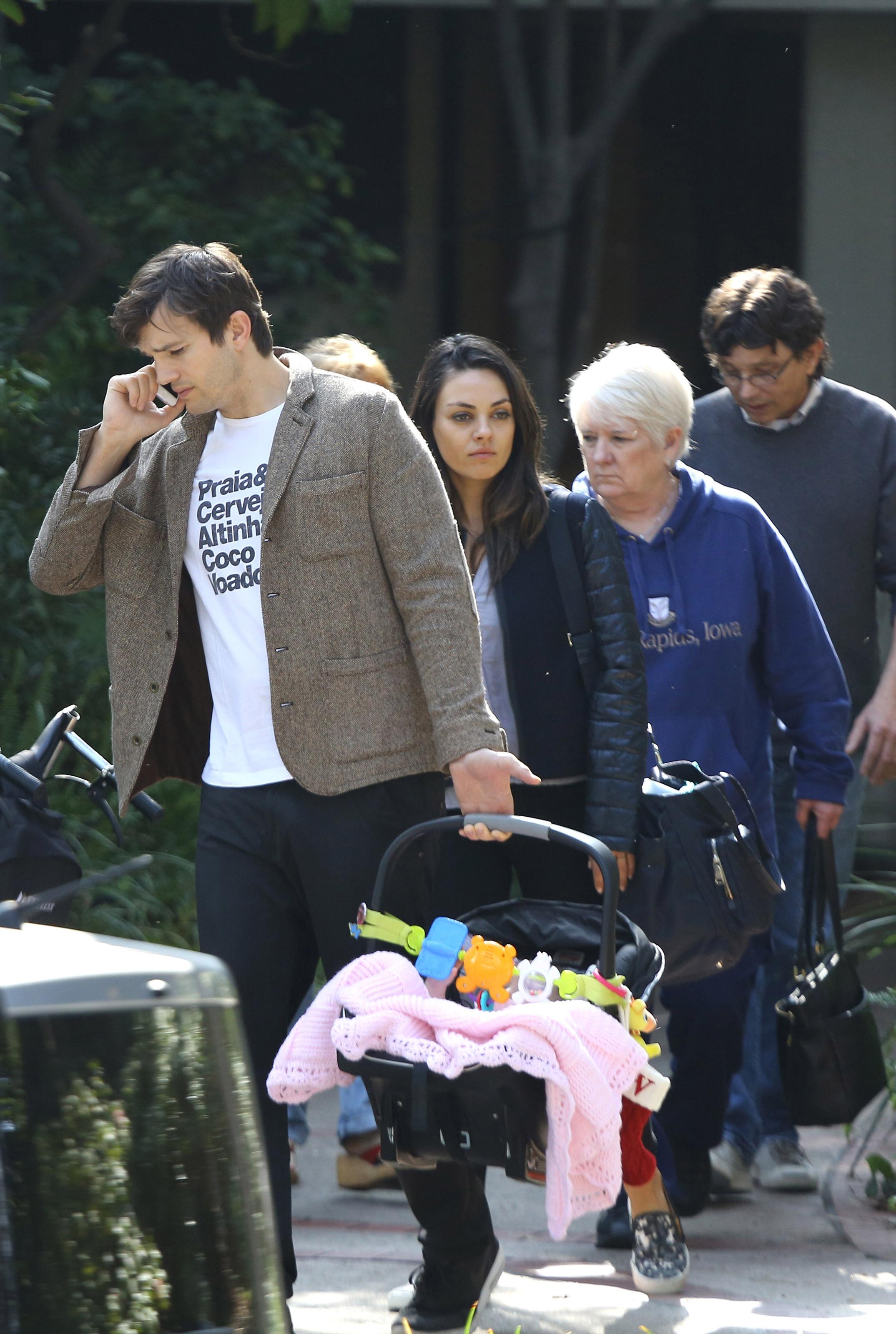 Ashton Kutcher and Mila Kunis enjoy a day out with baby girl Wyatt and parents