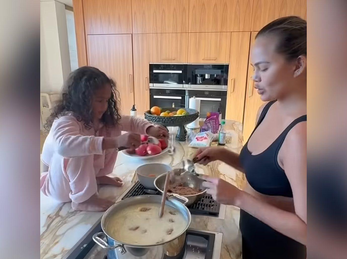 chrissy teigen criticized daughter put bare feet kitchen counter cooking