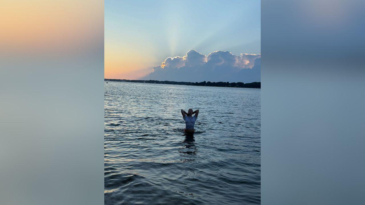 image of Gabby Windey shared a series of beach photos showing herself enjoying a sunset by the water.