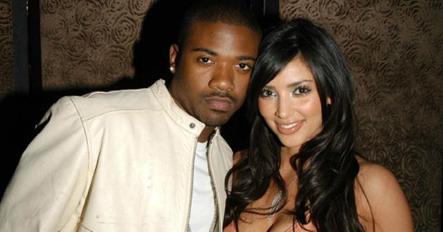 Ray J and Kim Kardashian pose for a photo.