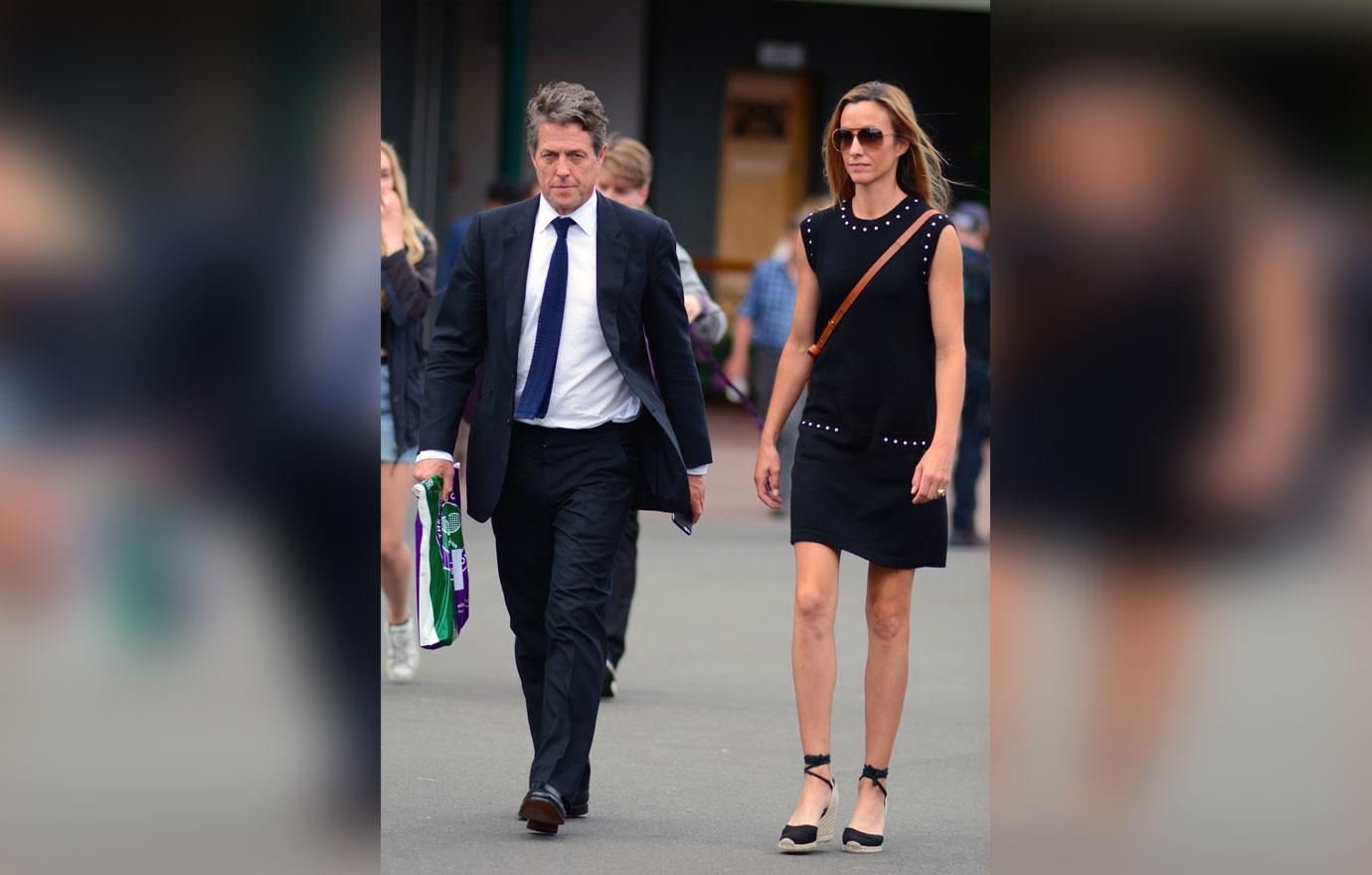 *EXCLUSIVE* Hugh Grant and Anna Eberstein sport a fashionable look at Wimbledon