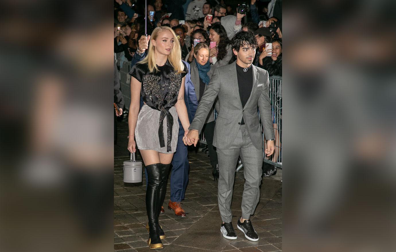 Jennifer Aniston and Justin Theroux in matching black at Louis Vuitton  event in Paris