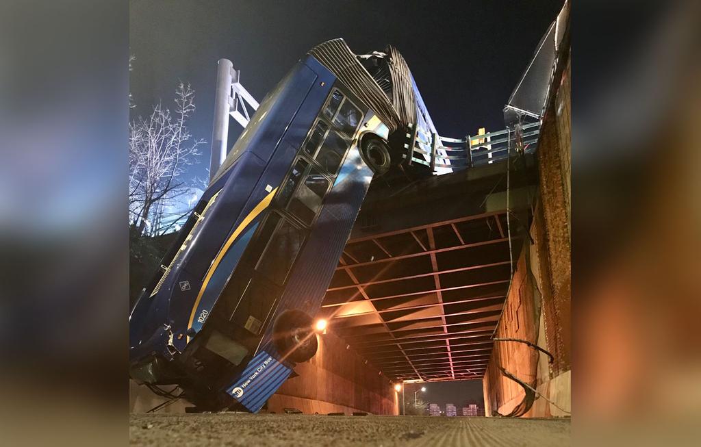 city bus hangs off overpass city bus hangs off overpass