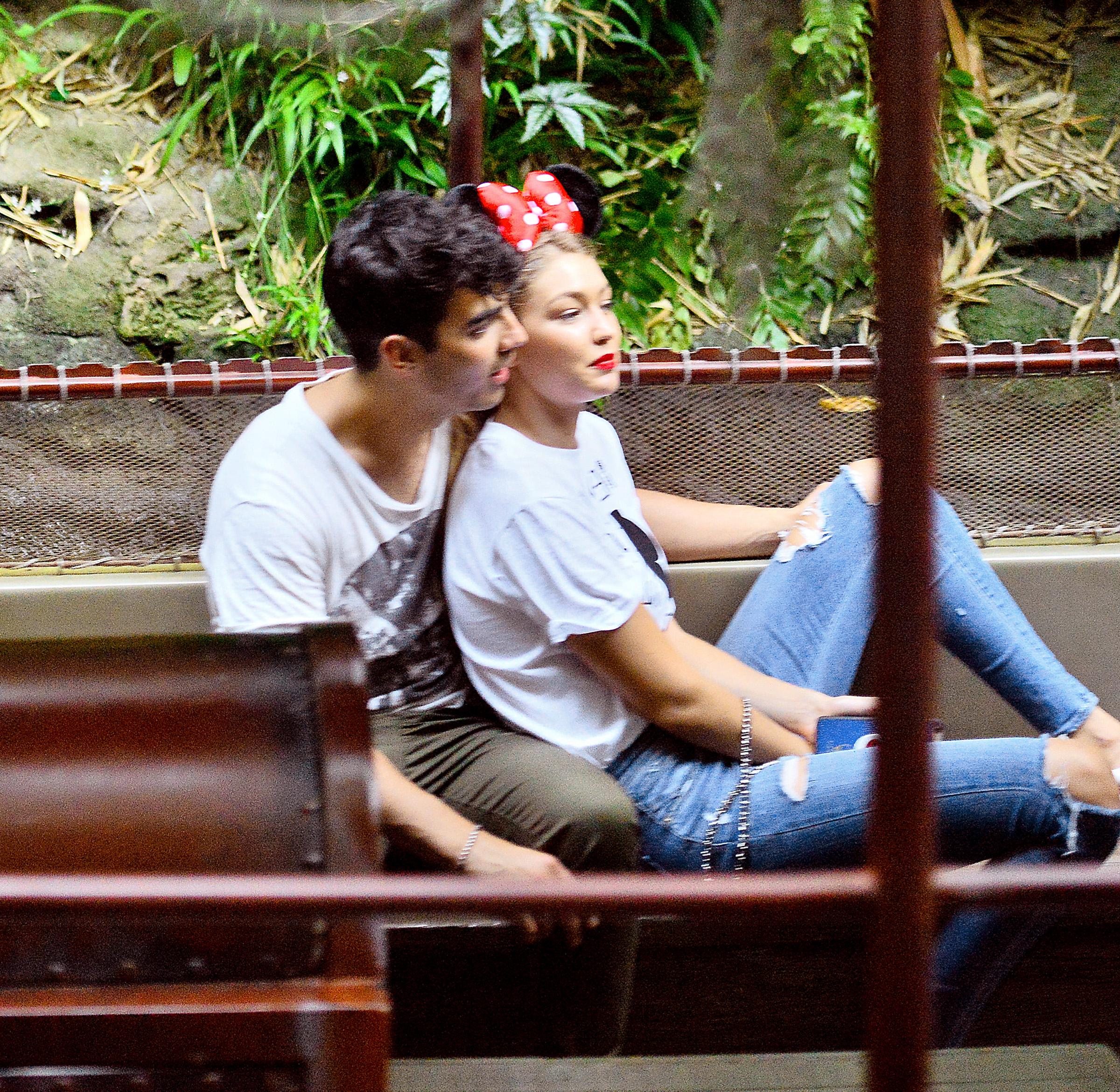 EXCLUSIVE: Joe Jonas and Gigi Hadid jokingly act like they’re asleep while taking a plunge on Splash Mountain at Disneyland in Anaheim, CA.