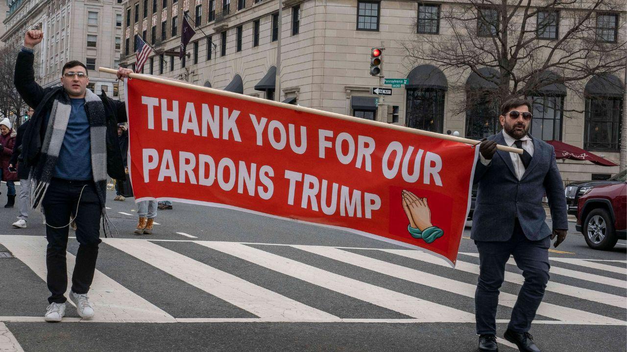 Image of protesters with a sign