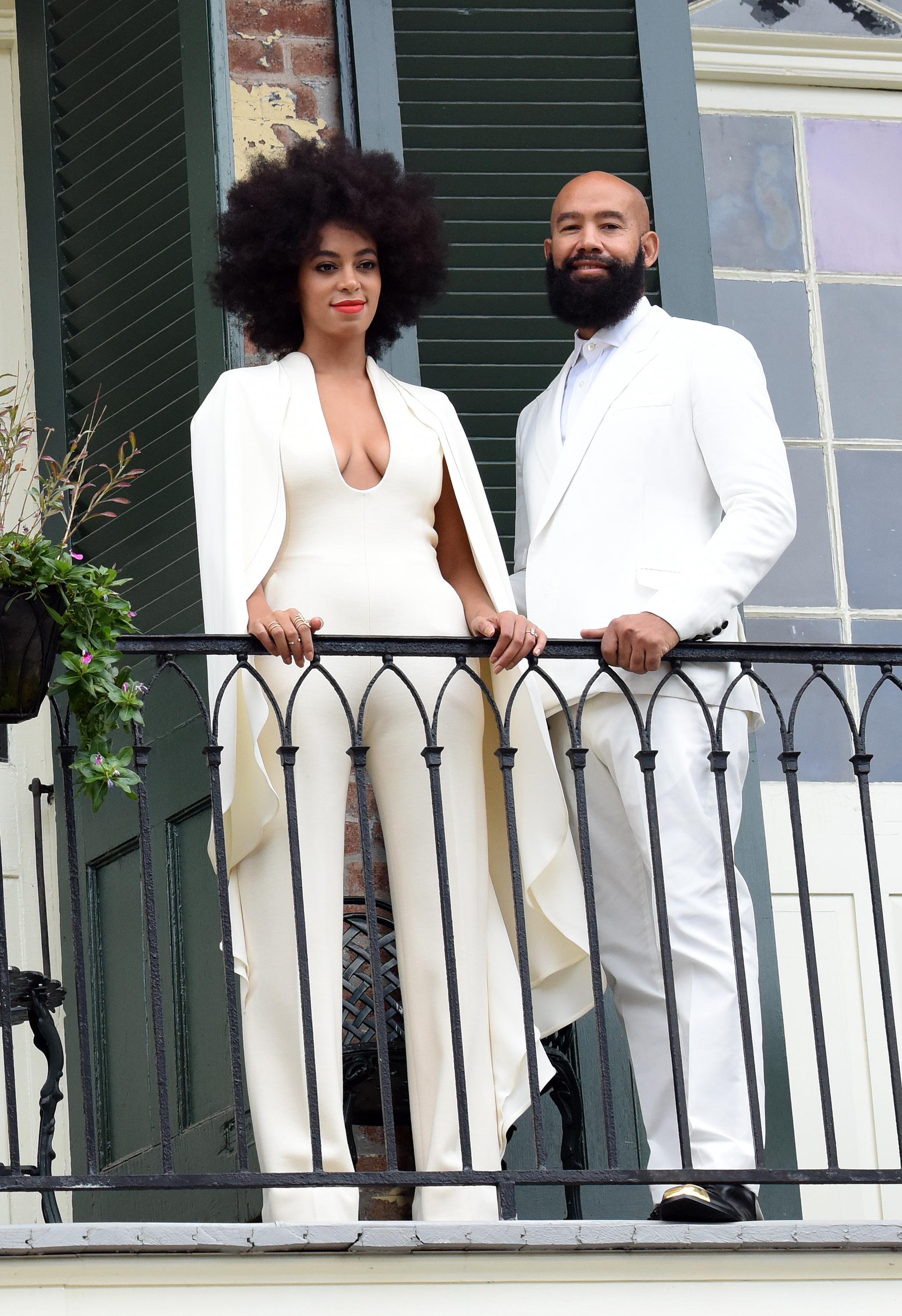 INF &#8211; Solange Knowles wears a white pantsuit on her Wedding day while posing with Fiance Alan Ferguson on a balcony just before the Wedding