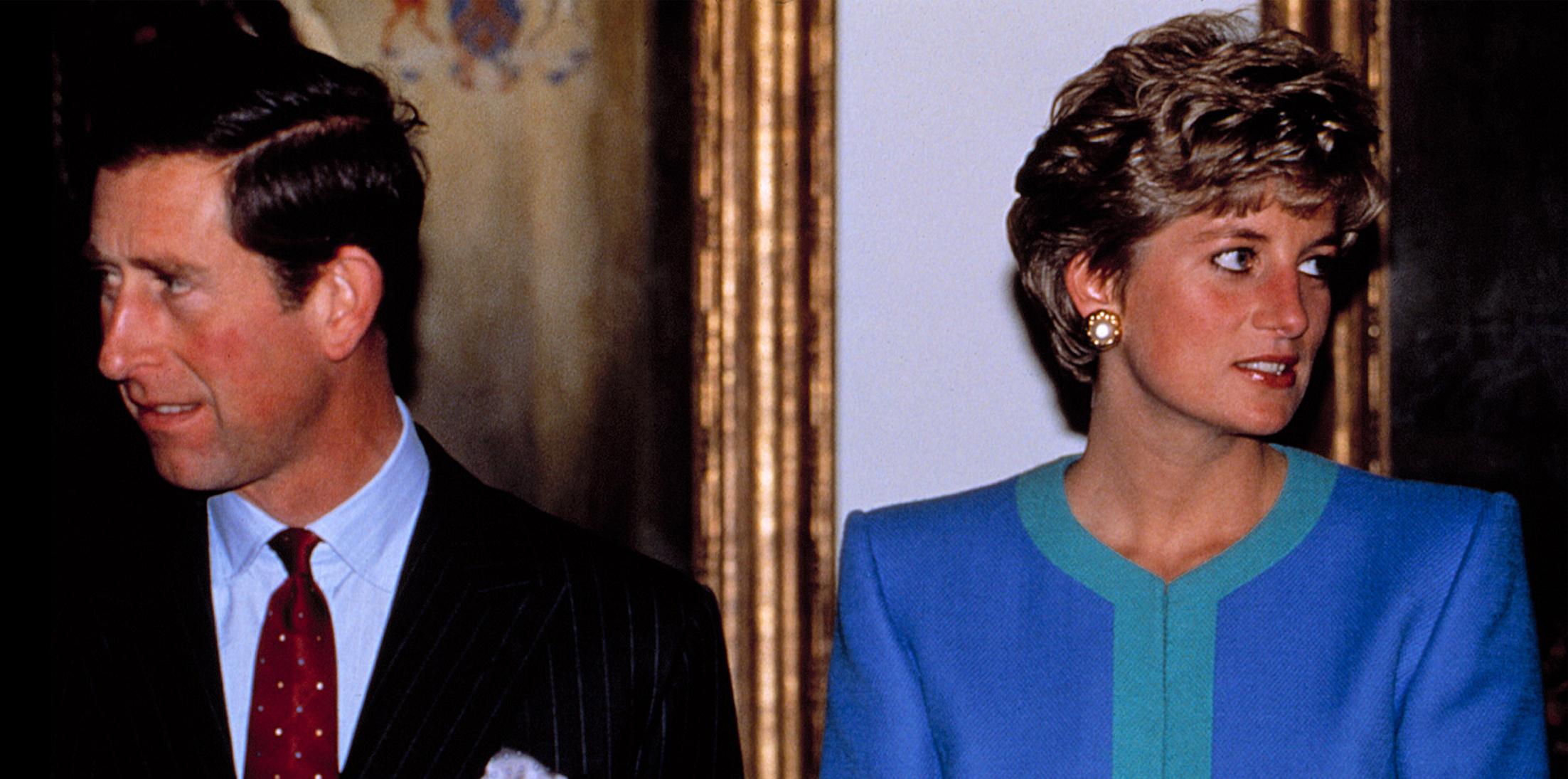 Prince Charles and Princess Diana looking in opposite directions of each other.