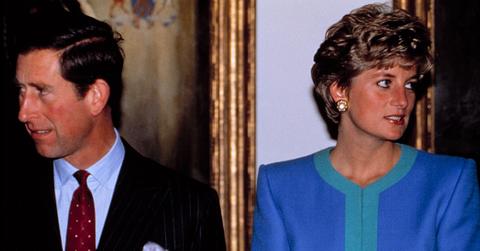 Prince Charles and Princess Diana looking in opposite directions of each other.