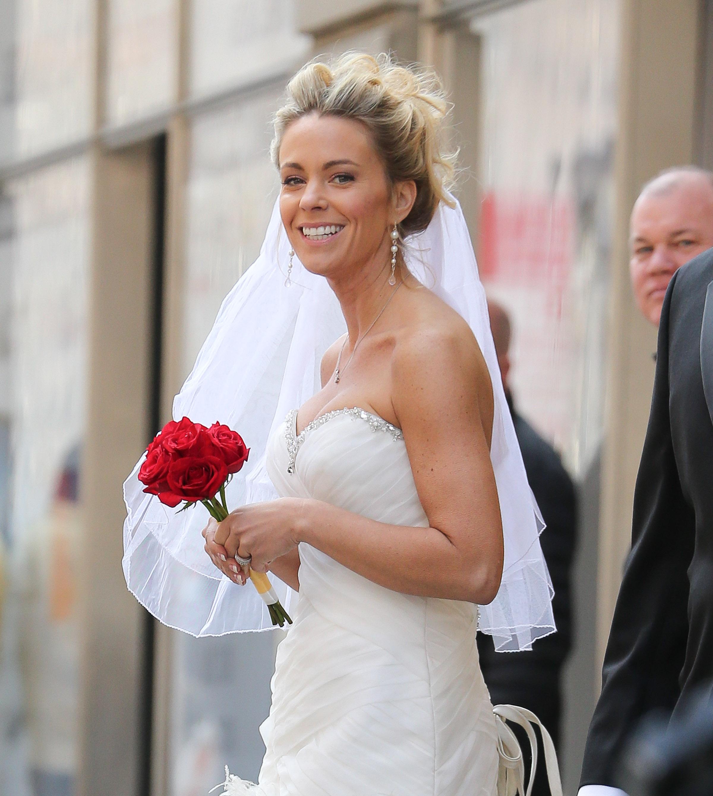 Kate Gosselin spotted wearing a short wedding dress and holding a red roses to promote &#8216;Brides For A Day&#8217; in New York City