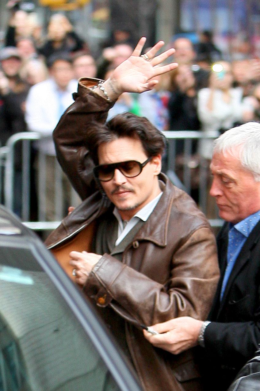 Johnny Depp has very hands on bodyguards in New York